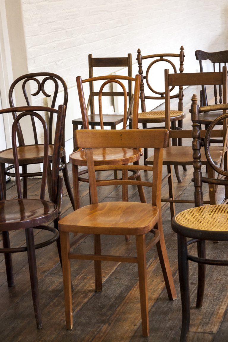 mismatched wooden chairs
