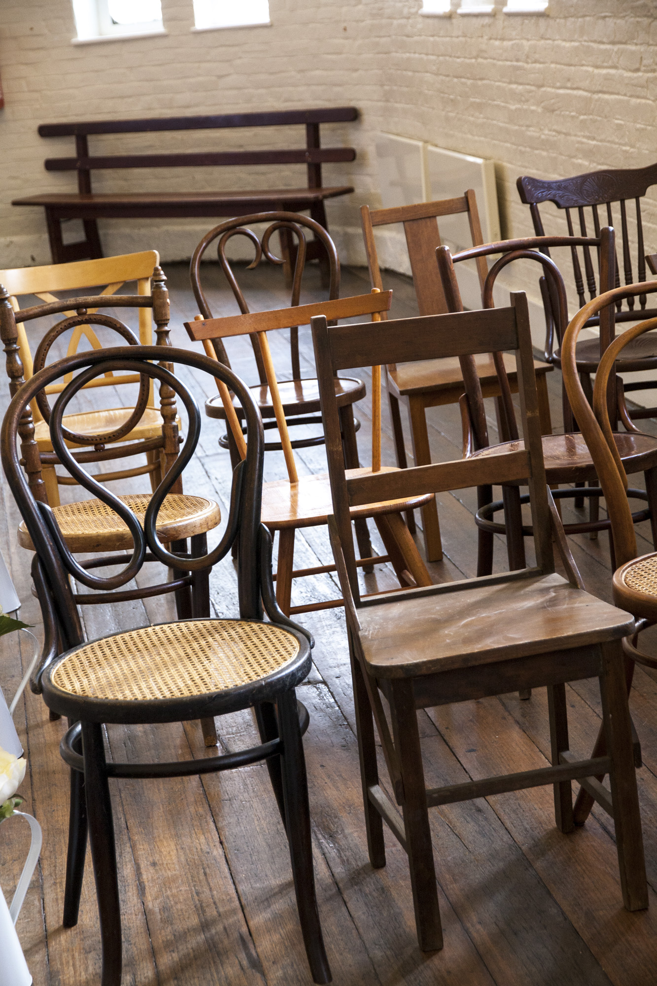 mismatched wooden chairs